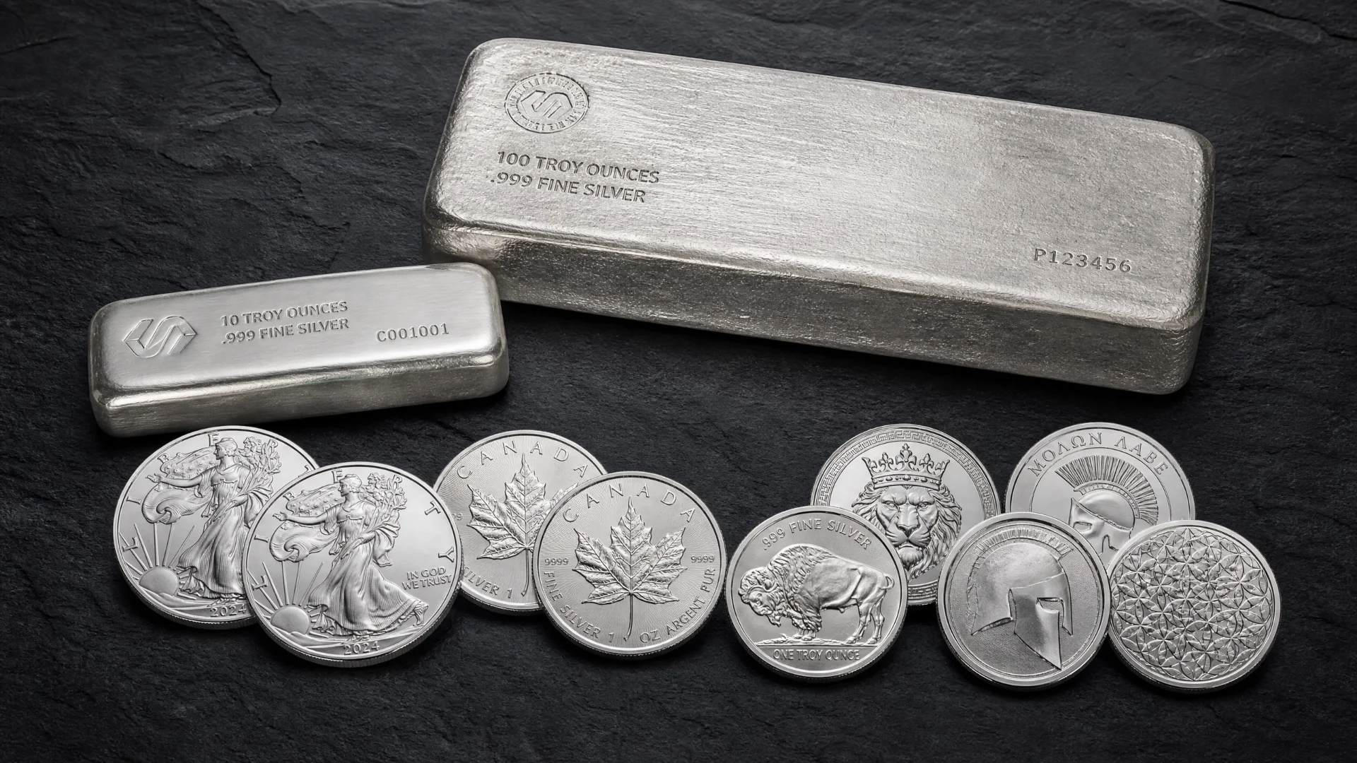 Comparison of silver bullion products: government coins, private rounds, and large silver bars.